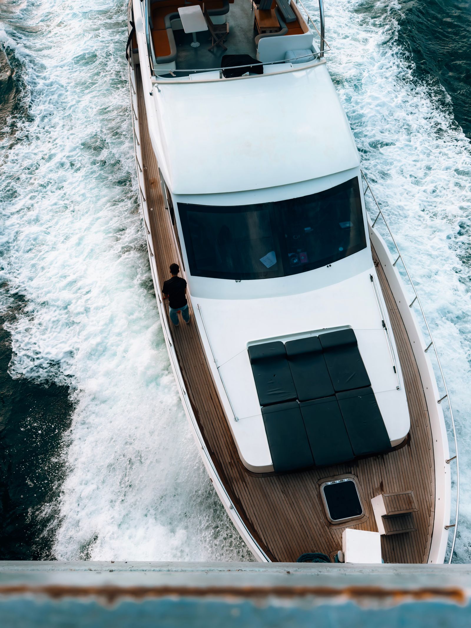 Luxury yacht on open water, seen from above