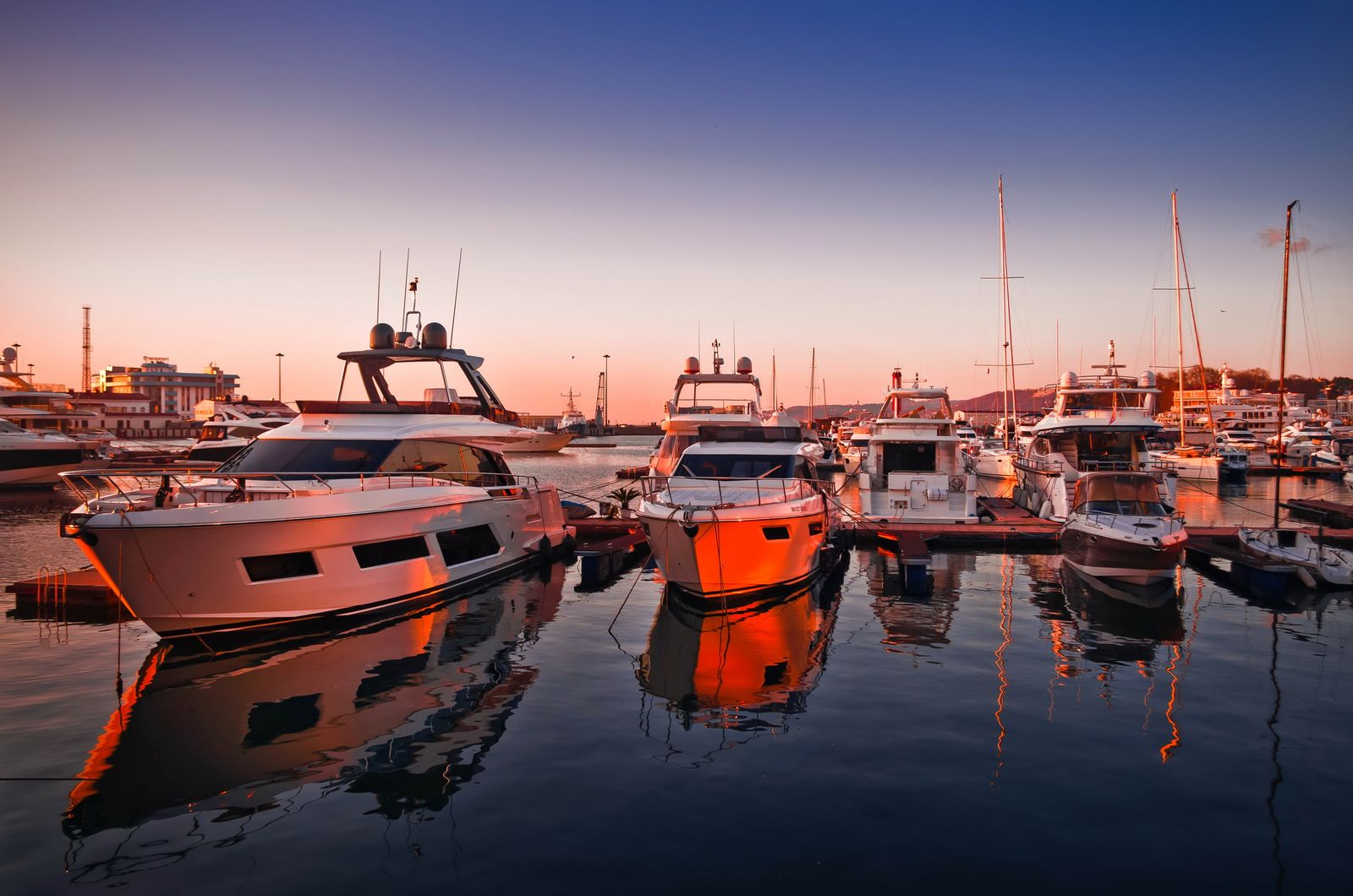 Marina with yachts at sunset